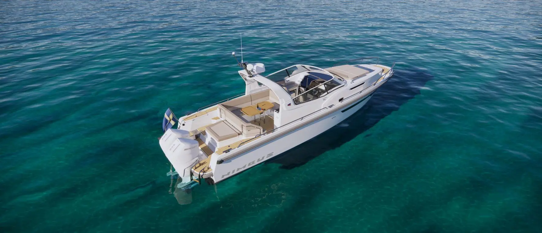 A sleek white Nimbus boat anchored in clear turquoise waters, featuring spacious seating and a small table on deck.